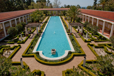 The central pool in the courtyard of the Getty Villa - Credit: Getty