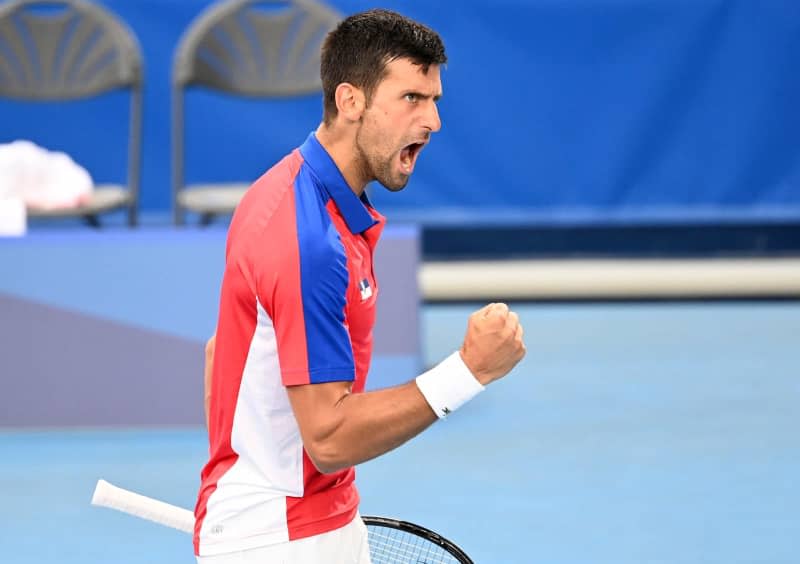 Serbian tennis player Novak Djokovic in action against German Jan-Lennard Struff during their Men's singles 2nd round tennis match of the Olympic Games Tokyo 2020 at Ariake Tennis Park. Marijan Murat/dpa