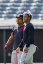 Cleveland Indians' Francisco Lindor, right, and Jose Ramirez watch batting practice during baseball practice at Progressive Field, Monday, July 6, 2020, in Cleveland. (AP Photo/Ron Schwane)