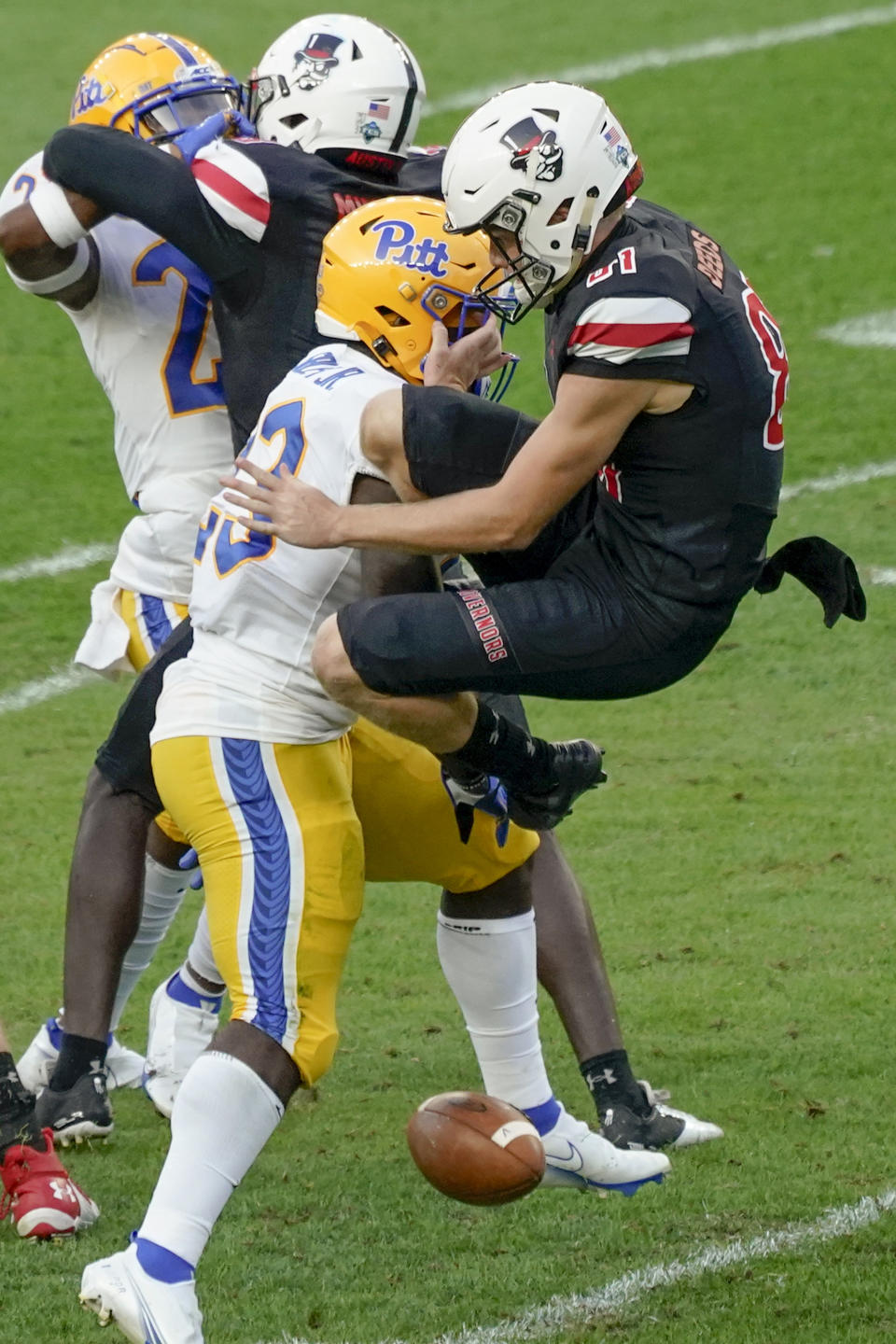 FILE - In this Saturday, Sept. 12, 2020, file photo, Pittsburgh's Todd Sibley Jr. (23) blocks a punt by Austin Peay punter Cole Deeds before returning it for a touchdown during the second half of an NCAA college football game, in Pittsburgh. The first 29 games of the 2020 college football season have exposed the toll coronavirus restrictions have taken on special teams play. (AP Photo/Keith Srakocic, File)