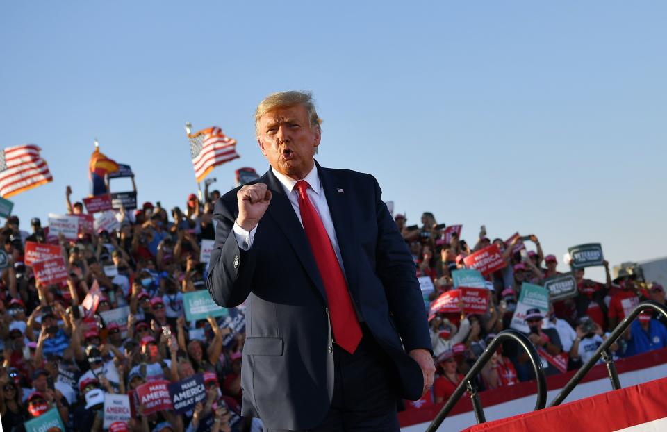 President Donald Trump holds a rally at Tucson International Airport on Oct. 19. He was not wearing a mask and neither were many of his rally attendees. (MANDEL NGAN via Getty Images)