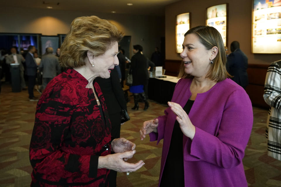 Sen. Debbie Stabenow, D-Mich., left, talks with Rep. Elissa Slotkin, Monday, Jan. 16, 2023, in Lansing, Mich. Rep. Slotkin is taking steps toward seeking the U.S. Senate seat held by Stabenow who is retiring. Slotkin has quickly shifted from fighting for her political life in the nation's third most-expensive U.S. House race last year to "at the very top" of the Michigan Democrats readying for a 2024 Senate campaign. (AP Photo/Carlos Osorio)