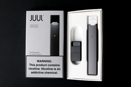 An electronic cigarette device made by JUUL is shown in this picture illustration taken September 14, 2018. REUTERS/Mike Blake/Illustration