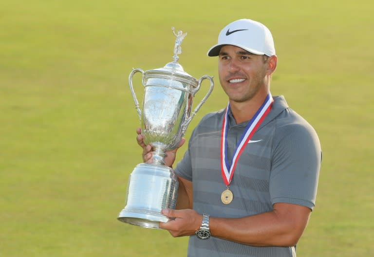 Brooks Koepka of the United States celebrates with the US Open Championship trophy