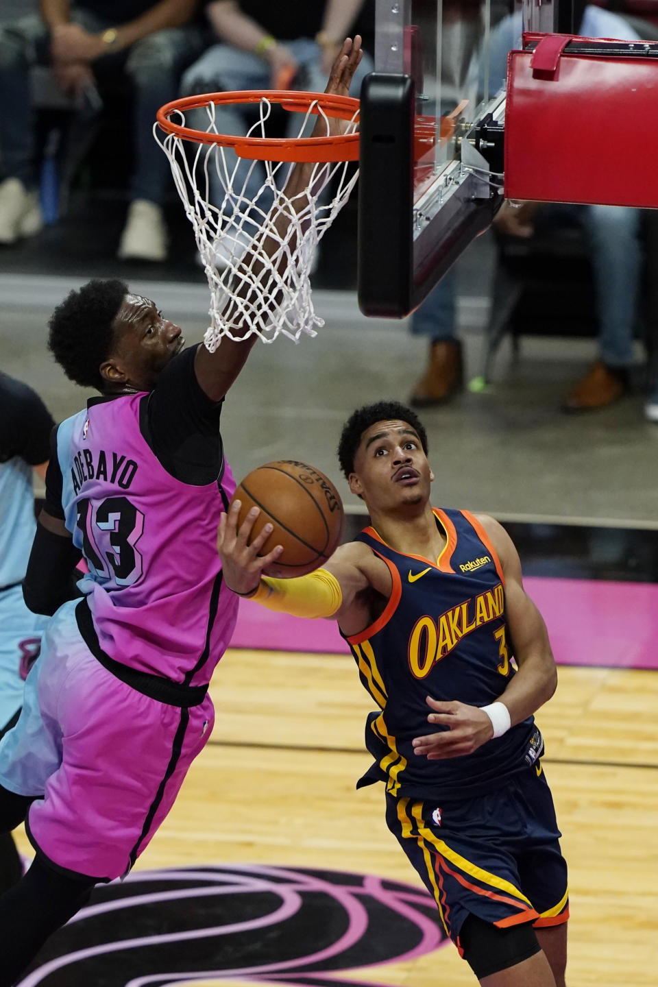 Golden State Warriors guard Jordan Poole (3) aims for a basket as Miami Heat center Bam Adebayo (13) defends during the first half of an NBA basketball game, Thursday, April 1, 2021, in Miami. (AP Photo/Marta Lavandier)