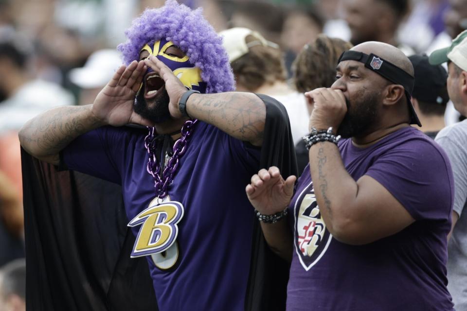 Baltimore Ravens fans cheer during a game against the New York Jets.