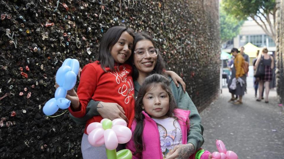 Orcutt resident Leslie Rico visited Bubblegum Alley with daughters 7-year-old Jennavive Hinojosa, left, and 4-year-old Arianna Santiago during the San Luis Obispo’s Downtown Farmers Market on Thursday, May 18, 2023.