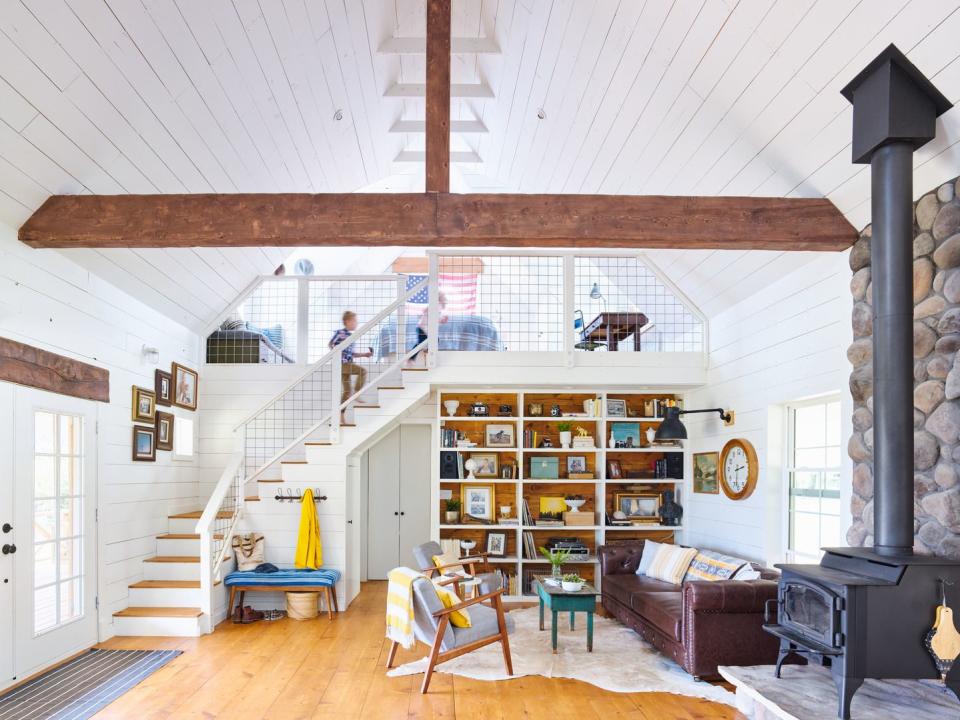 open concept farmhouse living room with sleeping loft