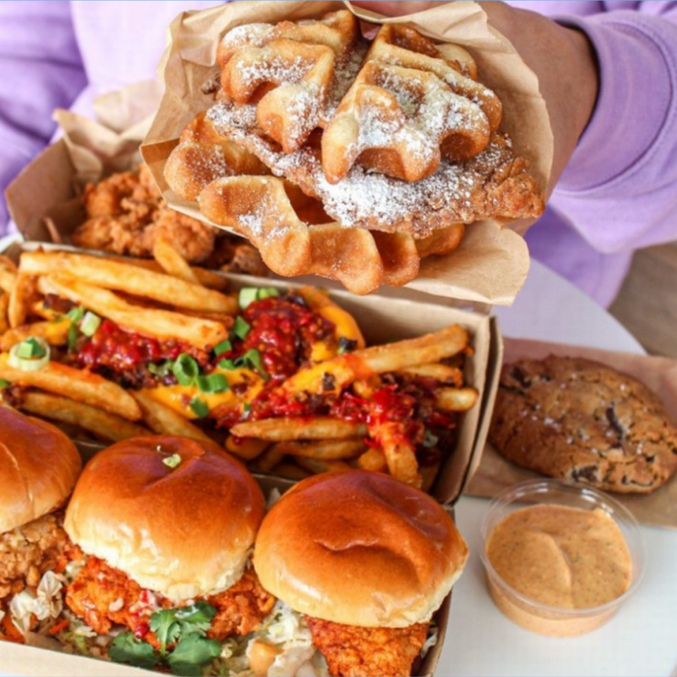 Chicken and waffles, loaded fries, and the chicken trio sliders from Daddy’s Chicken Shack. Courtesy photo by All Points Public Relations.