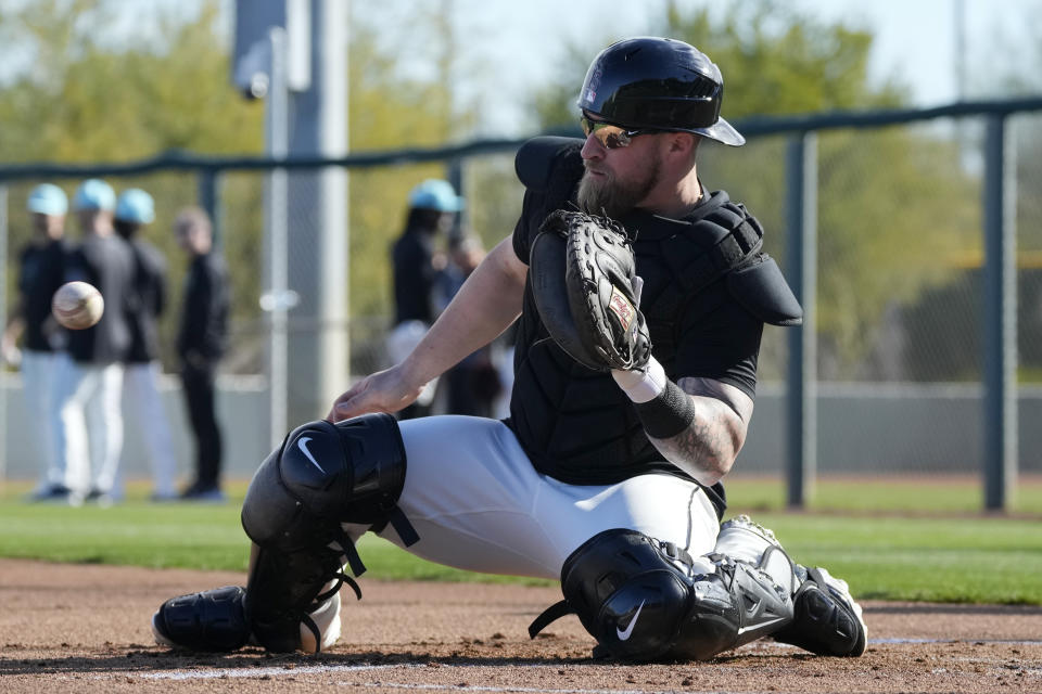 Tucker Barnhart became a Gold Glove shortstop in part by learning to work with starters such as Johnny Cueto. (AP Photo/Ross D. Franklin)