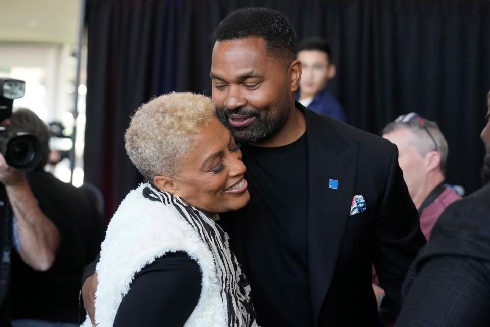 New Patriots head coach Jerod Mayo greets his mother, Denise, after a press conference Wednesday at Gillette Stadium.