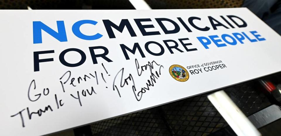 North Carolina Gov. Roy Cooper signed the placard that hung on the lectern where he announced that NC launched Medicaid expansion Friday. JEFF SINER/jsiner@charlotteobserver.com