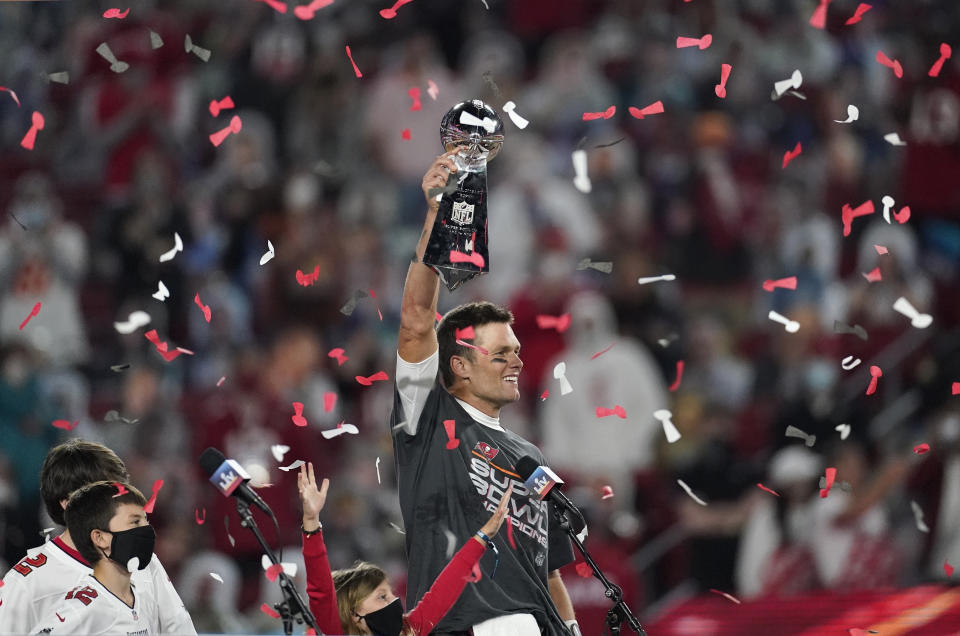 FILE - Tampa Bay Buccaneers quarterback Tom Brady holds up the Vince Lombardi trophy after defeating the Kansas City Chiefs in the NFL Super Bowl 55 football game, Feb. 7, 2021, in Tampa, Fla. Brady, the seven-time Super Bowl winner with New England and Tampa Bay, announced his retirement from the NFL on Wednesday, Feb. 1, 2023 exactly one year after first saying his playing days were over, by posting a brief video lasting just under one minute on social media. (AP Photo/Ashley Landis, File)