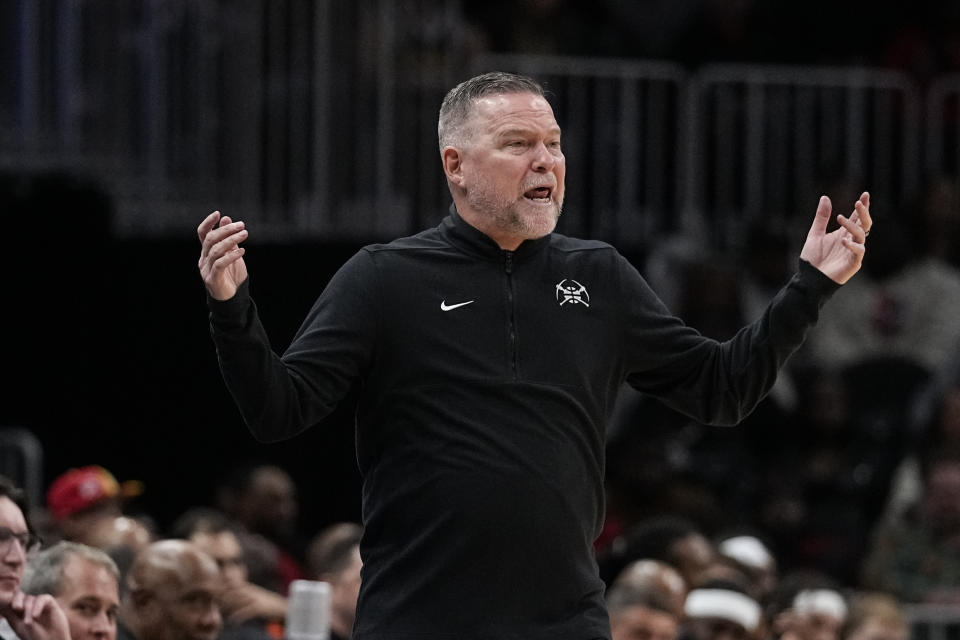 Denver Nuggets head coach Miichael Malone reacts on the sideline during the first half of an NBA basketball game against the Atlanta Hawks, Monday, Dec. 11, 2023, in Atlanta. (AP Photo/John Bazemore)