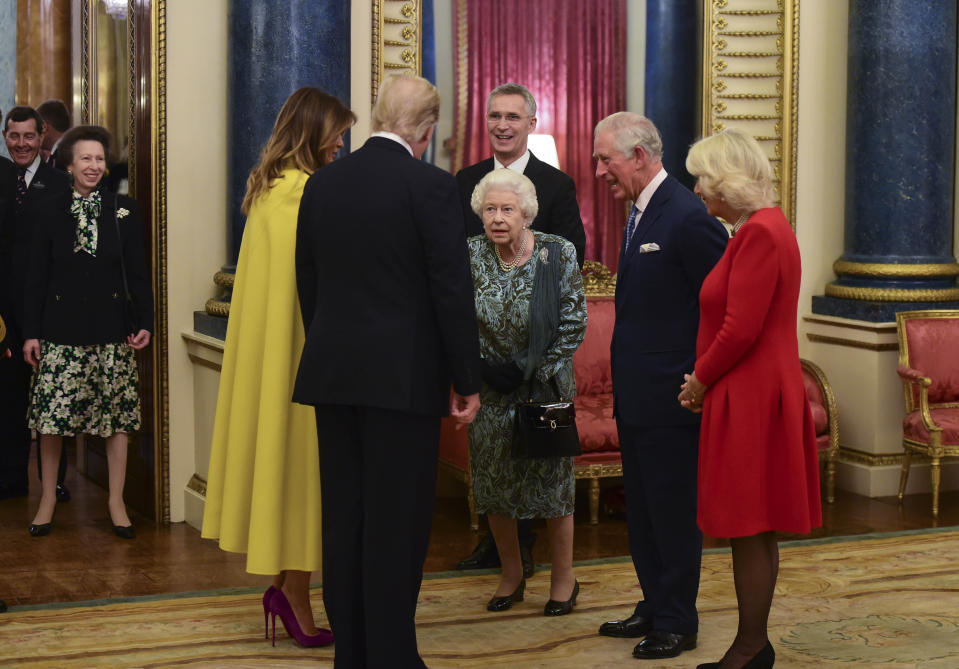 Photo by: KGC-512/STAR MAX/IPx 2019 12/3/19 The Queen, accompanied by other Members of the Royal Family, hosts a reception for NATO leaders, spouses or partners, and delegations, at Buckingham Palace in London, England. Here, Queen Elizabeth, Melania Trump, Donald Trump, Prince Charles, Camilla