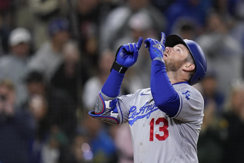 Los Angeles Dodgers' Max Muncy gestures after hitting a home run during the fifth inning of the team's baseball game against the San Diego Padres, Friday, April 22, 2022, in San Diego. (AP Photo/Gregory Bull)