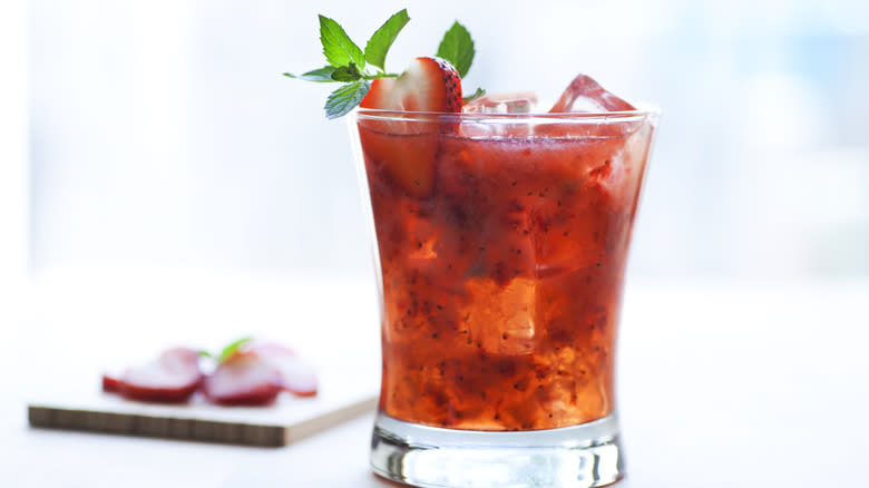 Red cocktail with strawberry
