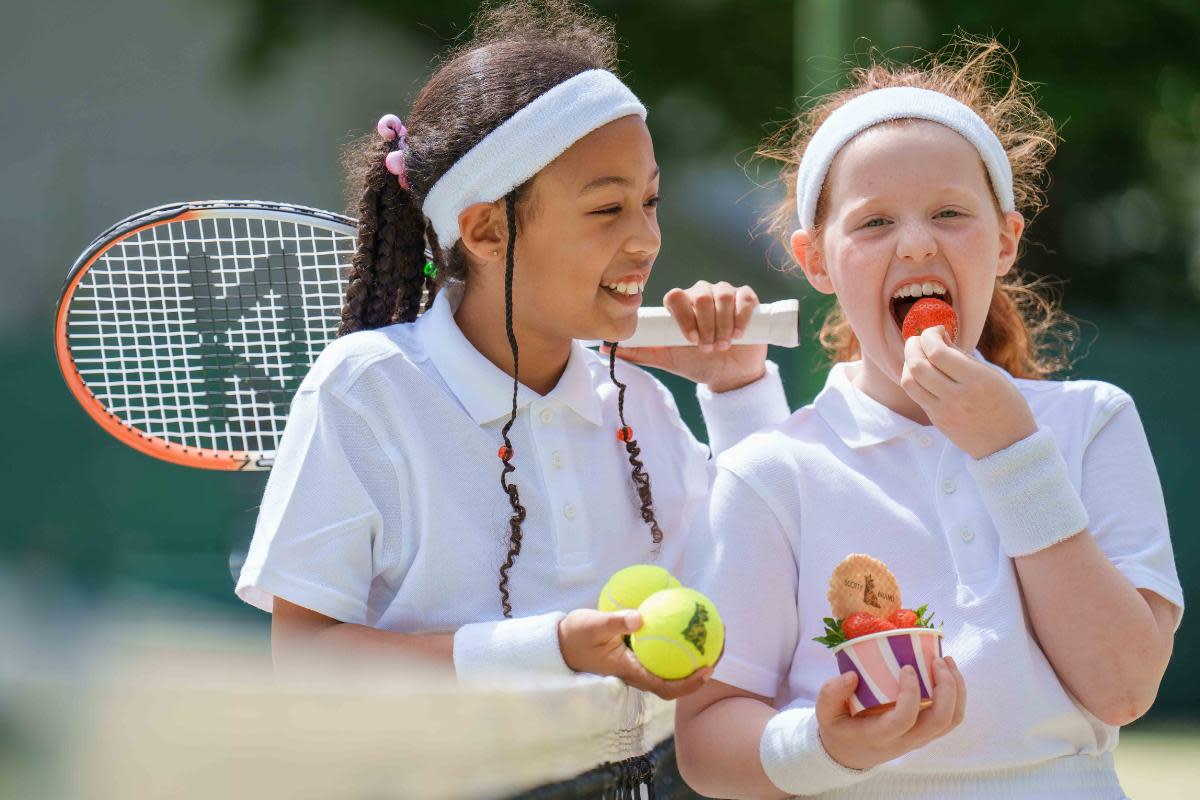 The pupils enjoyed Perthshire-grown strawberries by Scotty Brand at the Bearsden Tennis Club <i>(Image: Smarts Agency)</i>