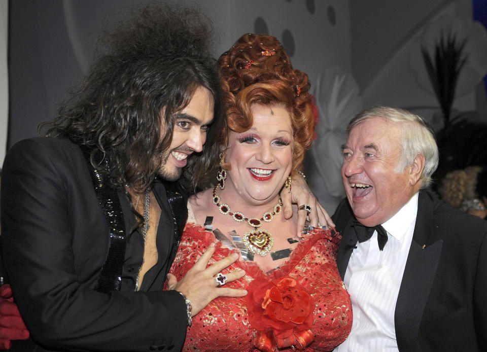 Russell Brand, Michael Ball dressed as Edna Turnblad from the musical Hairspray and Jimmy Tarbuck after the Royal Variety Performance at the Empire Theatre, Liverpool.