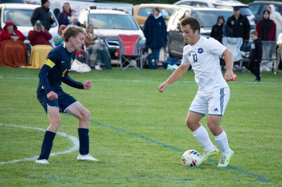 Hillsdale senior Joseph Miller defends against Hillsdale Academy senior Ridley Fast.