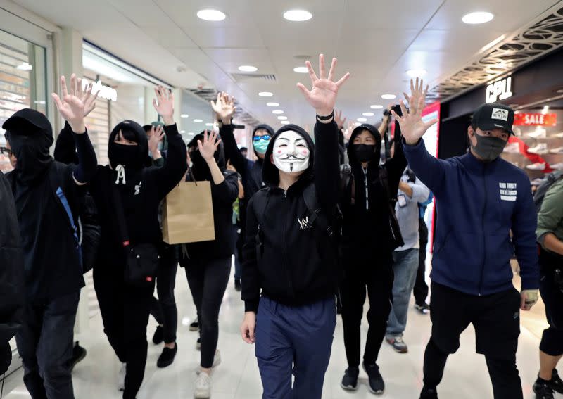 Anti-government demonstrators protest in Sheung Shui shopping mall in Hong Kong