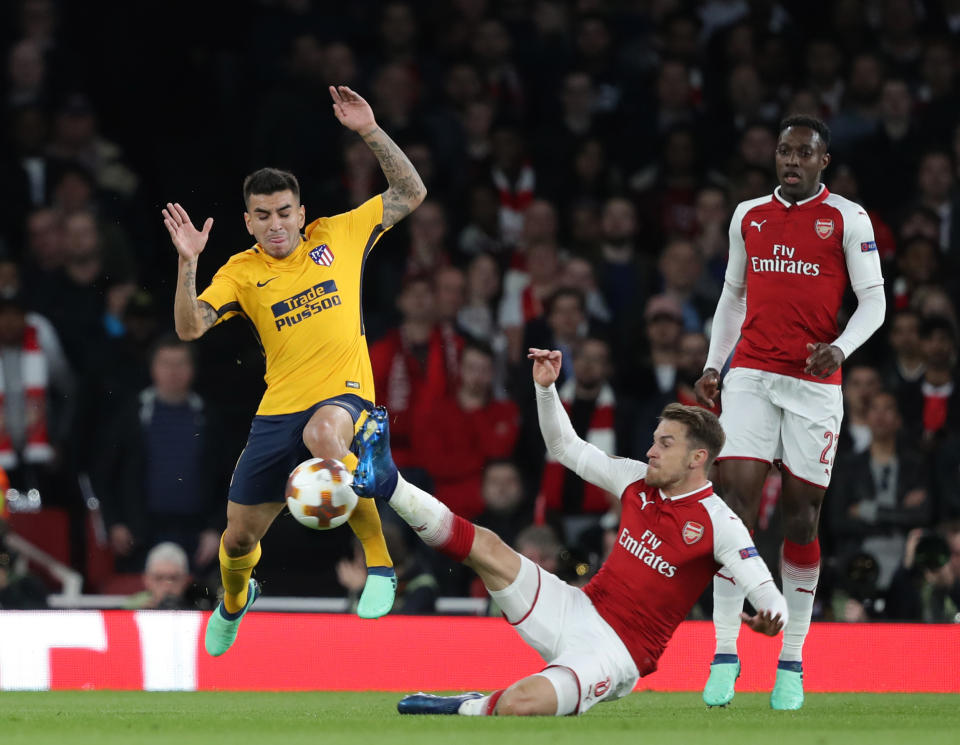 Angel Correa (L) of Atletico Madrid and Aaron Ramsey of Arsenal compete for the ball during the Europa League semi final leg one match between Arsenal and Atletico Madrid at The Emirates Stadiumcer