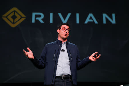 FILE PHOTO: R.J. Scaringe, Rivian's 35-year-old CEO, introduces his company's R1T all-electric pickup and all-electric R1S SUV at Los Angeles Auto Show in Los Angeles, California, U.S. November 27, 2018. REUTERS/Mike Blake