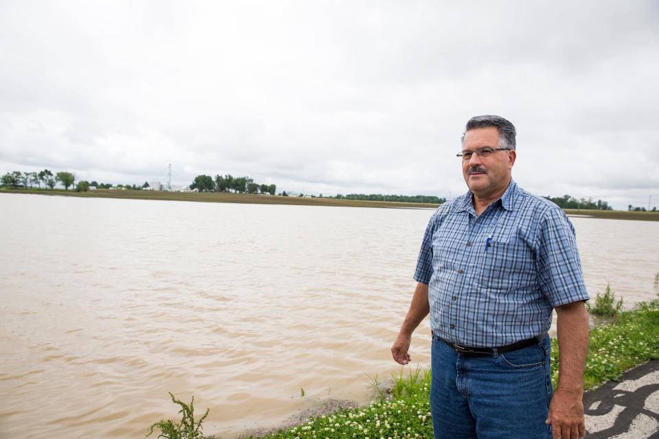 Scott Labig stands in front of a field Monday June 17, 2019 that should be planted with corn. An additional three inches of rain over the weekend made this area of his Darke County land look more like a lake than a farm. 
