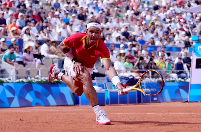 Rafael Nadal lunges for a forehand