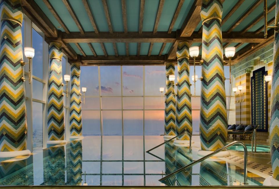 The saltwater infinity pool at the 5-star <strong>Burj Al Arab Jumeirah</strong> in Dubai is as if you're literally swimming through the clouds. There are millions of mosaic tiles in shades of azure and gold that line the pool.