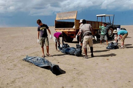 This photo taken May 3, shows bodies wrapped in black polythene bags as they are collected by Catholic missionaries in Todonyang, along the Kenya-Ethiopia border. At least 38 people were killed when Ethiopian armed men attacked a rival community in a remote border region of north Kenya, a local official said Wednesday, warning the toll could rise