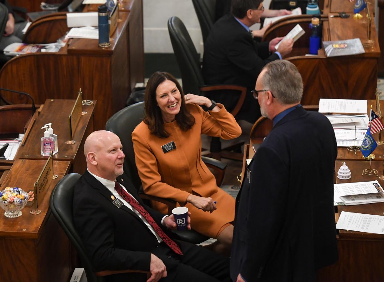 S.D. Senators Helene Duhamel and Jim Mehlhaff speak with fellow senator Reynold Nesiba on Tuesday, January 10, 2023, at the South Dakota State Capitol in Pierre.