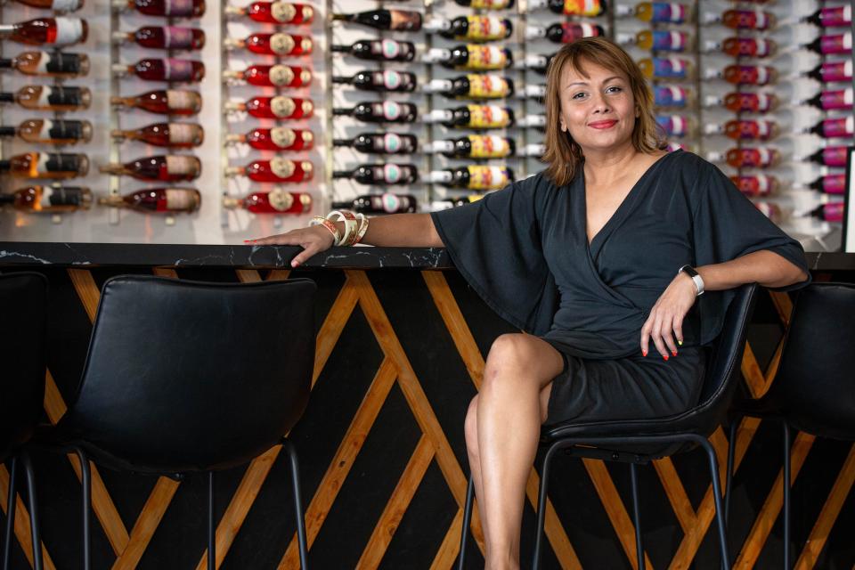 Zoya Vora-Shah, owner of the Wine Collective poses for a portrait at her venue in Scottsdale on June 16, 2022.