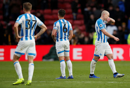 Soccer Football - Premier League - Watford v Huddersfield Town - Vicarage Road, Watford, Britain - October 27, 2018 Huddersfield Town's Erik Durm, Jonathan Hogg and Aaron Mooy looks dejected after the match REUTERS/David Klein