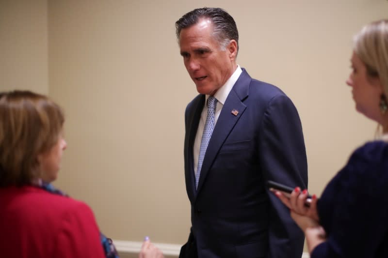 U.S. Senator Romney talks to reporters as he departs after the weekly Republican caucus luncheon at the U.S. Capitol in Washington