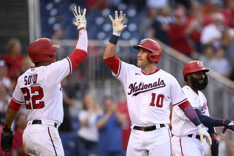 Washington Nationals' Yan Gomes (10) celebrates his grand slam with Juan Soto (22) during the first inning of the team's baseball game against the Pittsburgh Pirates, Tuesday, June 15, 2021, in Washington. (AP Photo/Nick Wass)