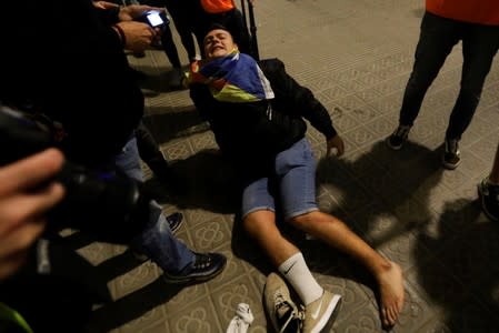 Separatists protest after a verdict in a trial over a banned Catalonia's independence referendum in Barcelona