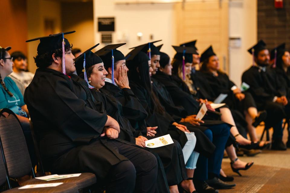 Graduates of the High School Equivalency Program wait to hear their names called during a ceremony at Colorado State University Pueblo's Occhiato Student Center on June 29, 2023.