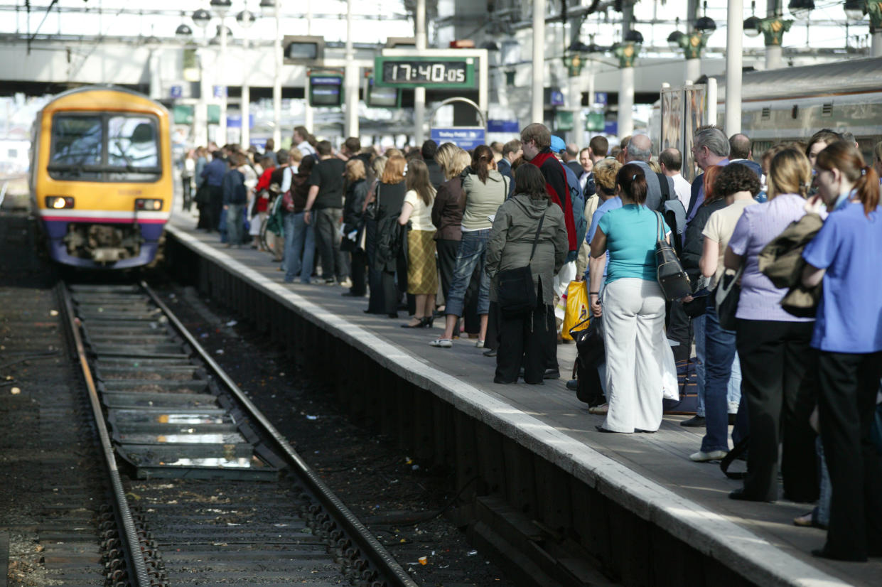 Rush hour travellers throng the platform at Manchester Piccadilly station as a suburban train approaches. May 2005, United Kingdom. (Photo by Rail Photo/Construction Photography/Avalon/Getty Images)