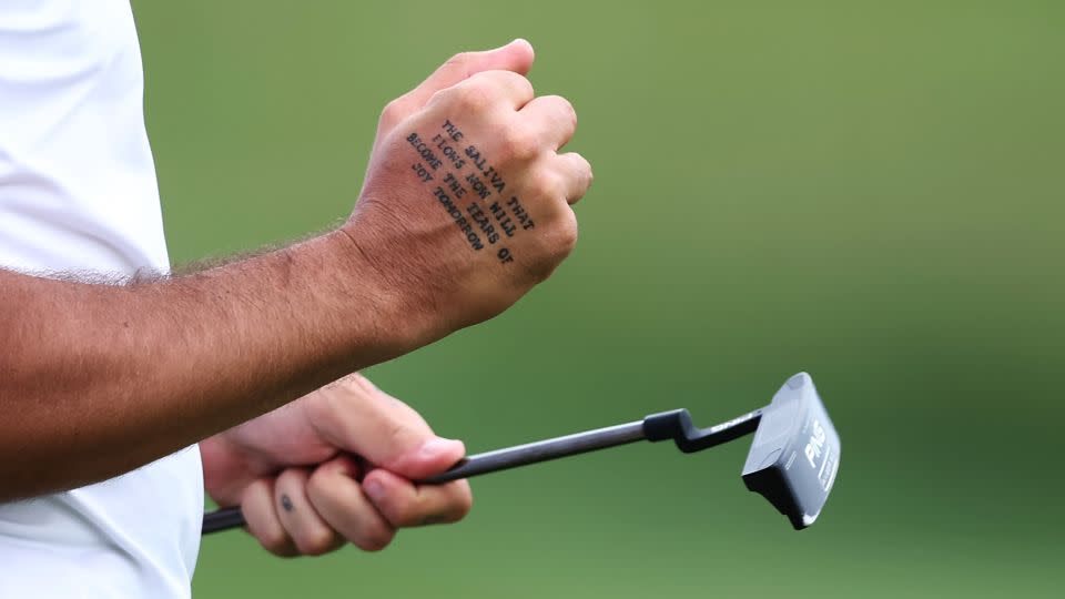 The tattoo on Pavon's right hand is a reassuring presence to the golfer. - Naomi Baker/Getty Images