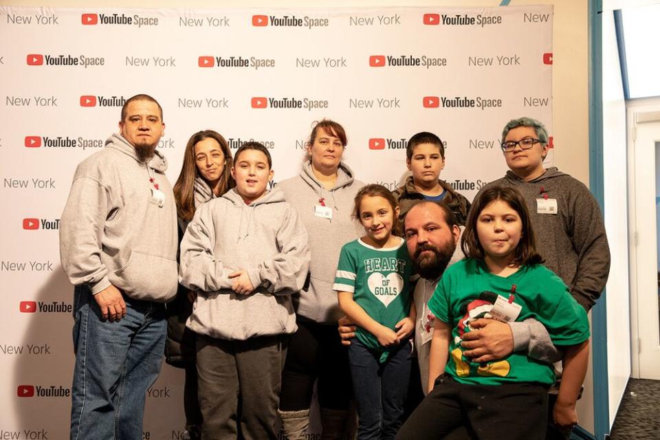 Shawny Smith with his family and friends, including mom Monica Velozo, who stands behind him | YouTube Spaces