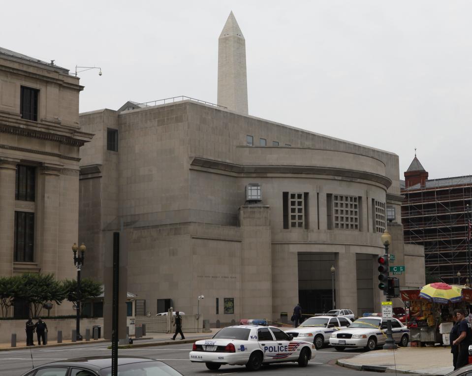 FILE - In this June 10, 2009, file photo, the Washington Monument looms over the U.S. Holocaust Memorial Museum in Washington after a James Von Brunn opened fire. Police found anti-Semitic writings justifying the attack in von Brunn's car. He died in prison while awaiting trial. (AP Photo/Charles Dharapak, File)