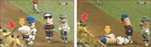 In this video screen grab, Pittsburgh Pirates first baseman Randall Simon (marked by red arrow) can be seen taking a swing at Guido, the Italian sausage character (yellow arrow), during the sausage race at Miller Park on July 9, 2003.