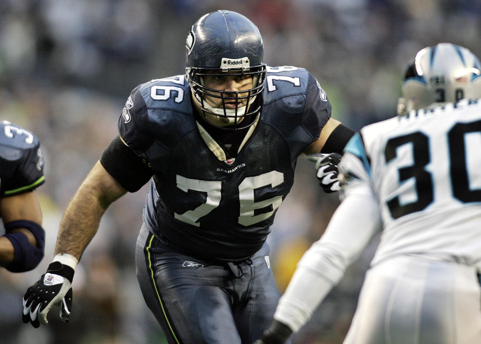 FILE - In this Jan. 22, 2006, file photo, Seattle Seahawks offensive tackle Steve Hutchinson blocks against the Carolina Panthers during the NFC championship football game in Seattle. Hutchinson set a lot of the standards for NFL guards during his 12-season career spent primarily with the Seattle Seahawks and Minnesota Vikings. After a one-year wait due to the COVID-19 pandemic, Hutchinson will be inducted this weekend into the Pro Football Hall of Fame. (AP Photo/John Froschauer, File)