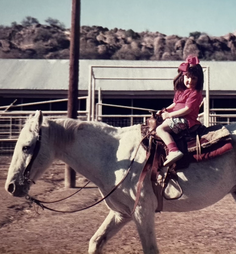 a girl riding a horse