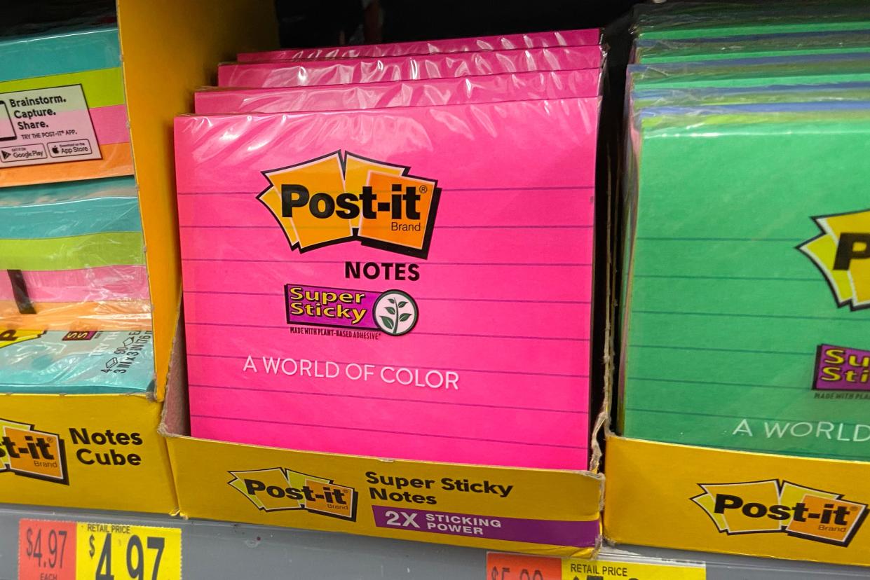 Packs of Post-It notes on the shelves of a store