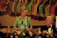 <p>When in Russia, the Queen naturally had to wear her glitziest gown with huge emerald jewellery.<br><i>[Photo: PA]</i> </p>