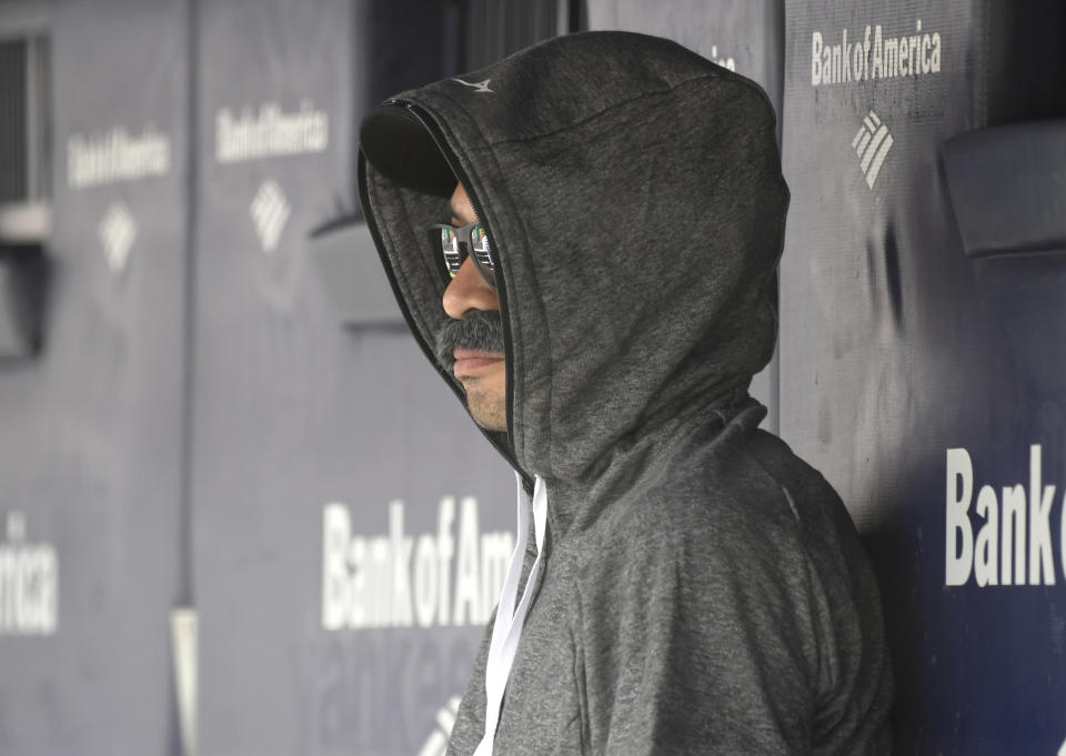 Seattle Mariners’ Ichiro Suzuki sits in the dugout and watches the New York Yankees bat during the first inning of Thursday’s game. (AP Photo/Bill Kostroun)