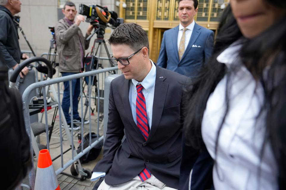Brian Kolfage leaves court after being sentenced for defrauding donors to the We Build the Wall effort on Wednesday in New York. The co-founder of a fundraising group linked to Steve Bannon that promised to help Donald Trump construct a wall along the southern U.S. border has been sentenced to four years and three months in prison.