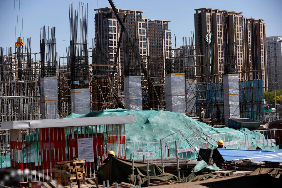 Workers work at a construction site of a subway station in Beijing, China April 18, 2023. REUTERS/Tingshu Wang